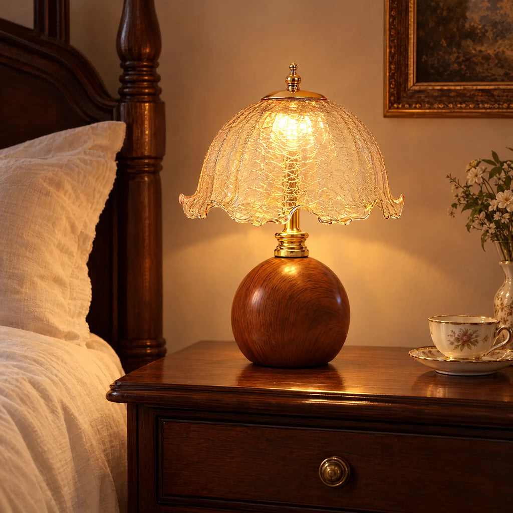 Crackle glass table lamp with wood-grain base on a nightstand