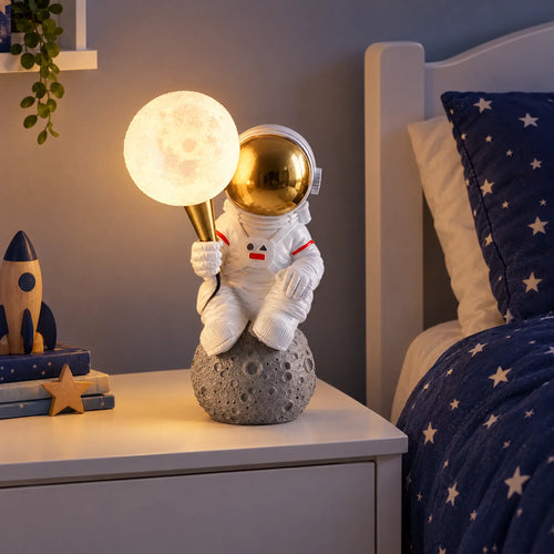 Astronaut resin table lamp with moon shade in a kids bedroom
